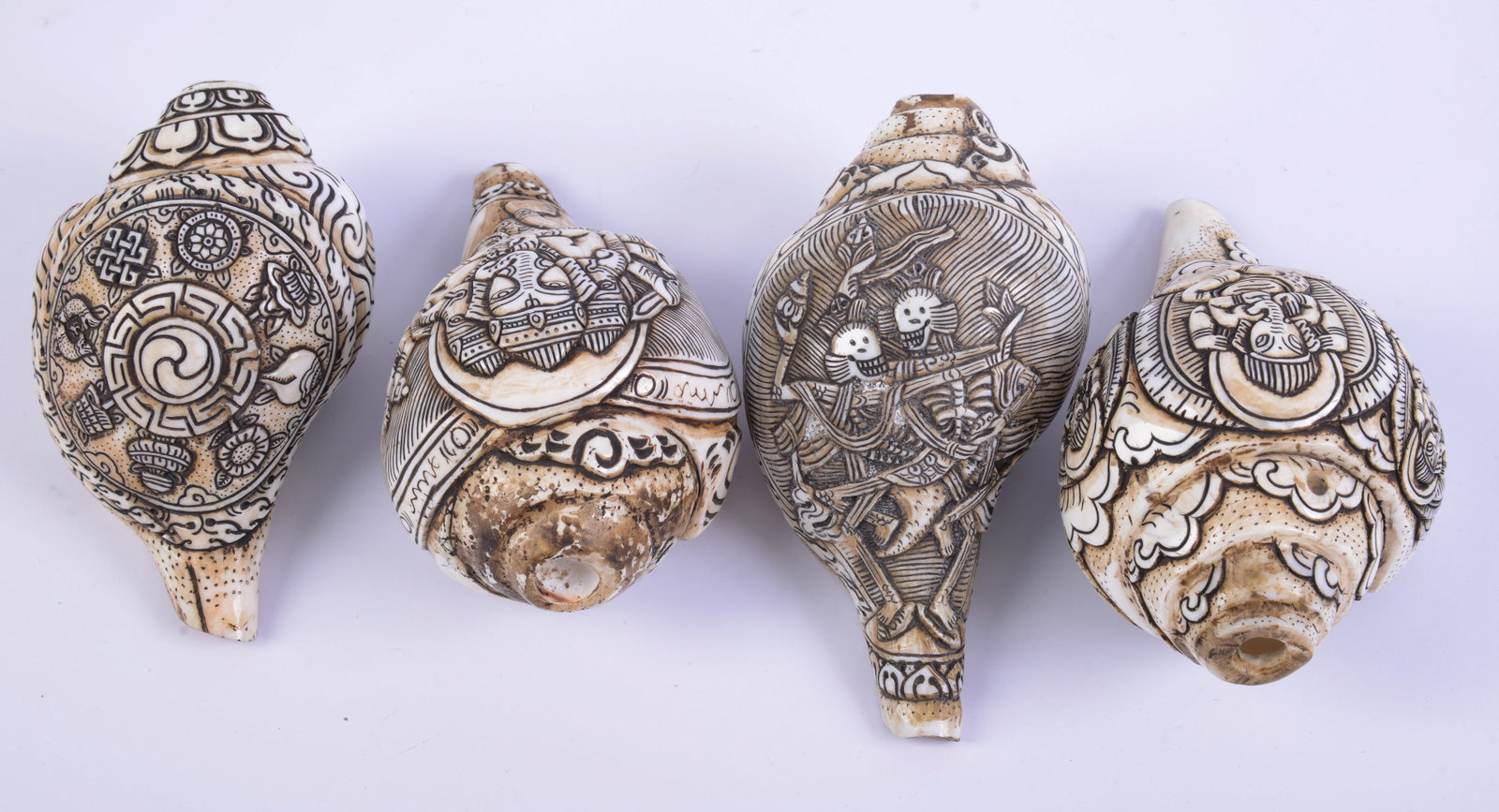Four Tibetan Carved Conch Shells. (1 of 3)