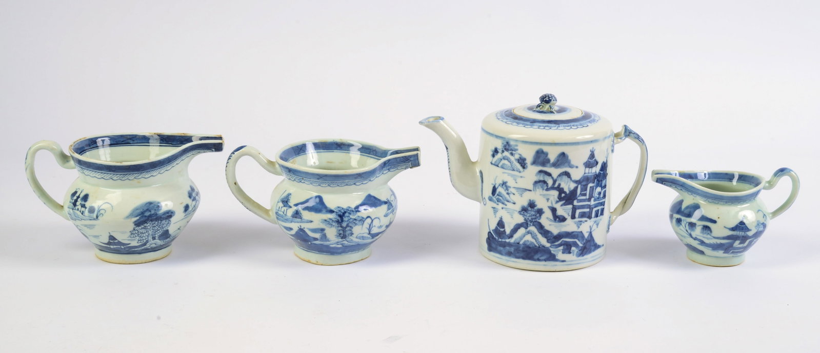 Canton Strap Handle Teapot and Three Spout Nose Creamers.: Overall height of teapot 5.5 inches. Chips to interior rim of teapot.