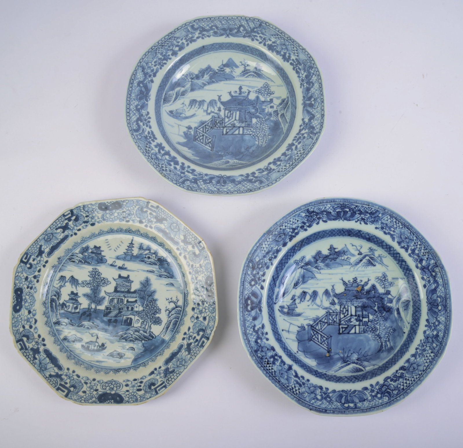 Pair of Chinese Blue and White Soup Plates.: With a similar dinner plate. Diameter 9 inches. Some chips and hairline.