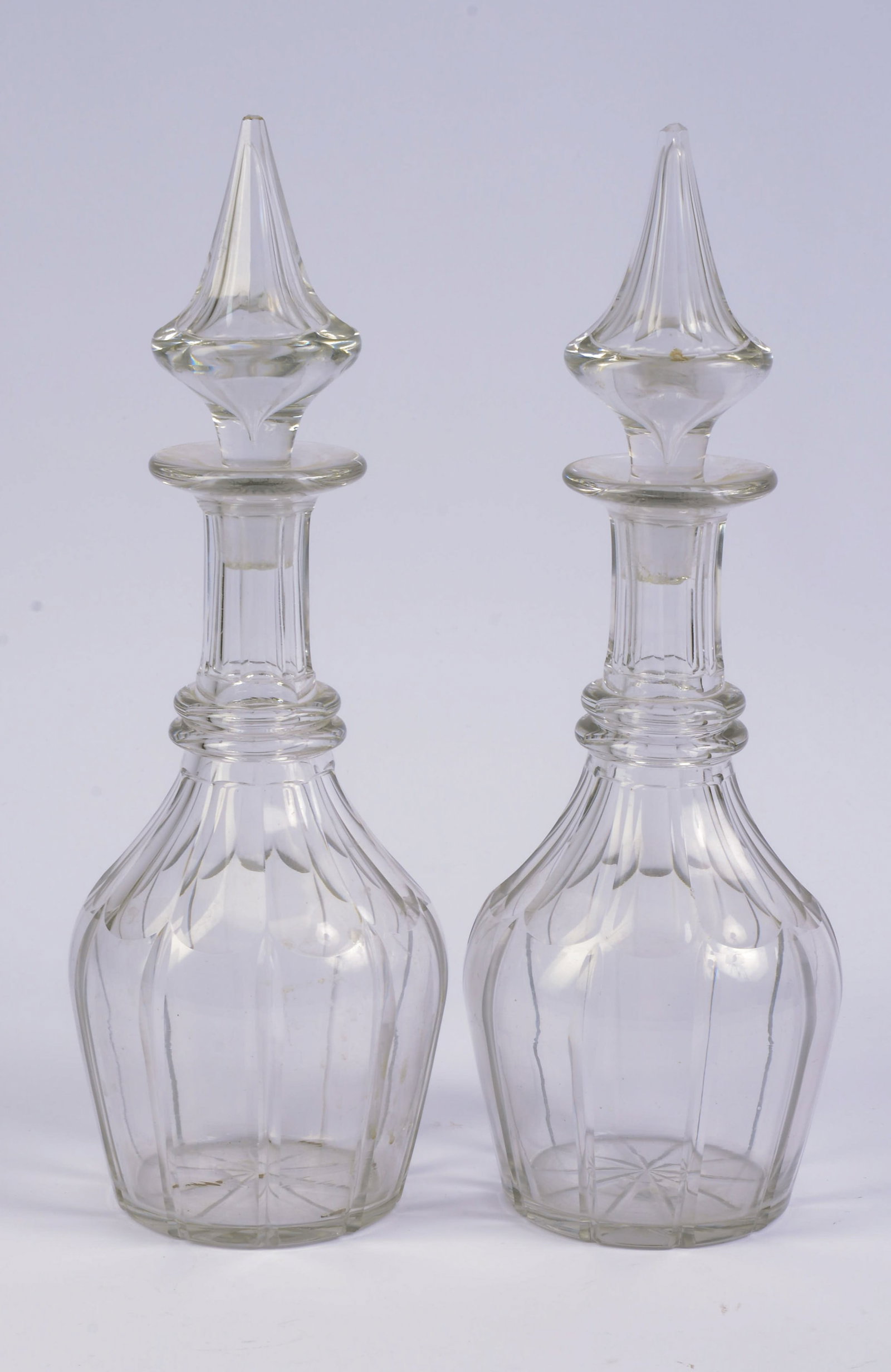 Pair of Panel-cut Decanters with Stoppers.: Height 13 inches.