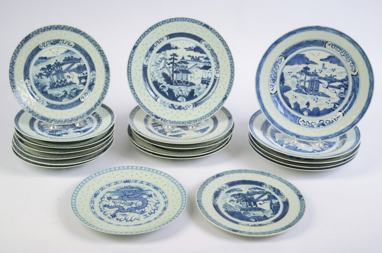 19 Chinese Rice Grain Blue and White Porcelain Dinner Plates.: Various sizes, diameter of larger 10.25 inches. Some chips and an old repair.