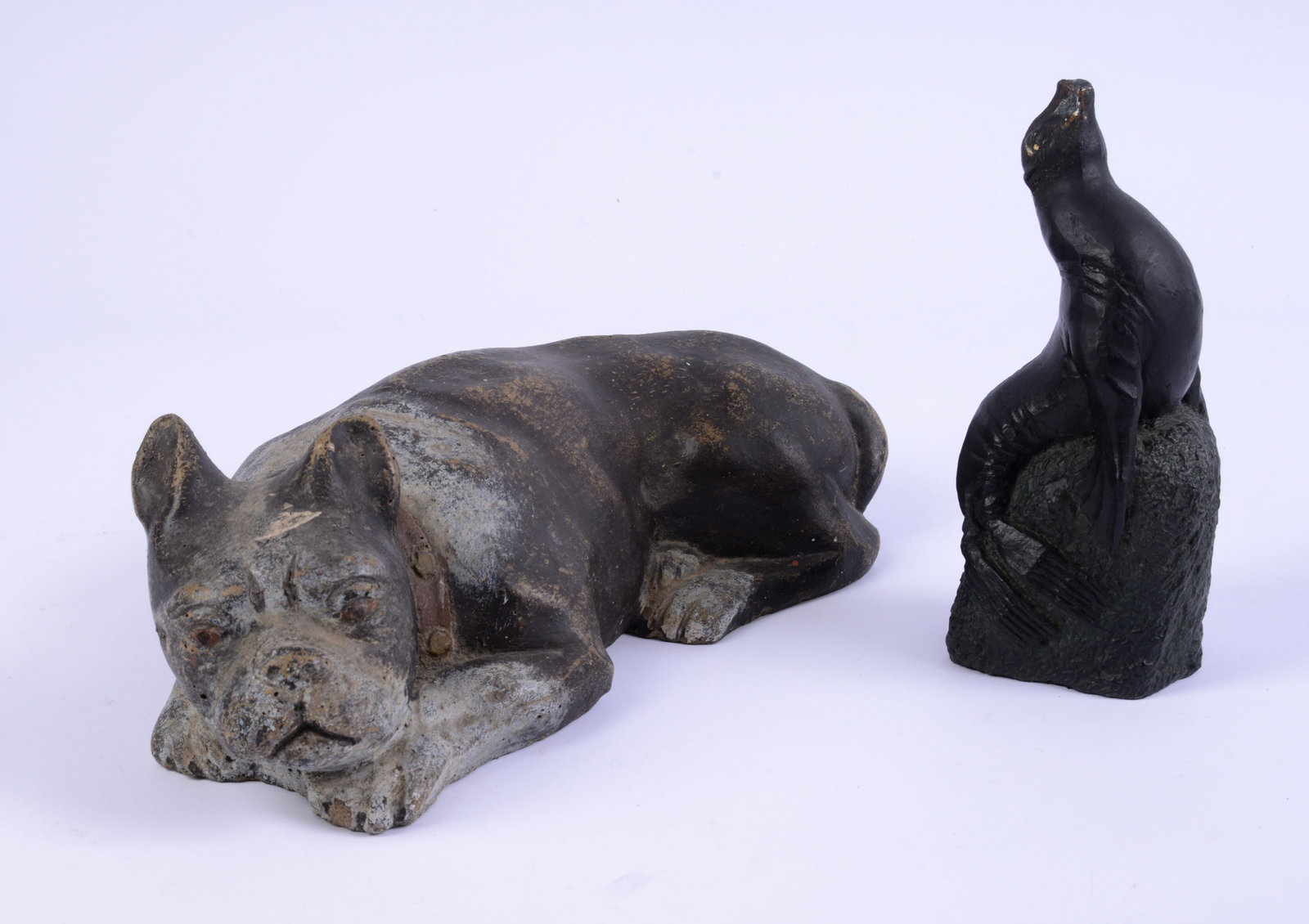 Cast Concrete Dog Form Doorstop and a Figure of a Seal on a Rock.: Length of first 13 inches.