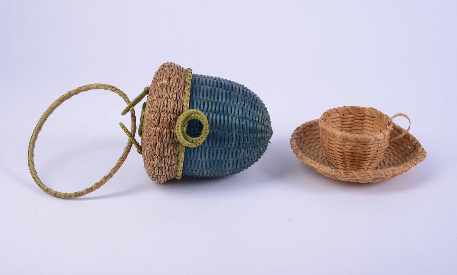 Two Native American Baskets.: Acorn form, height 5 inches, and a teacup.