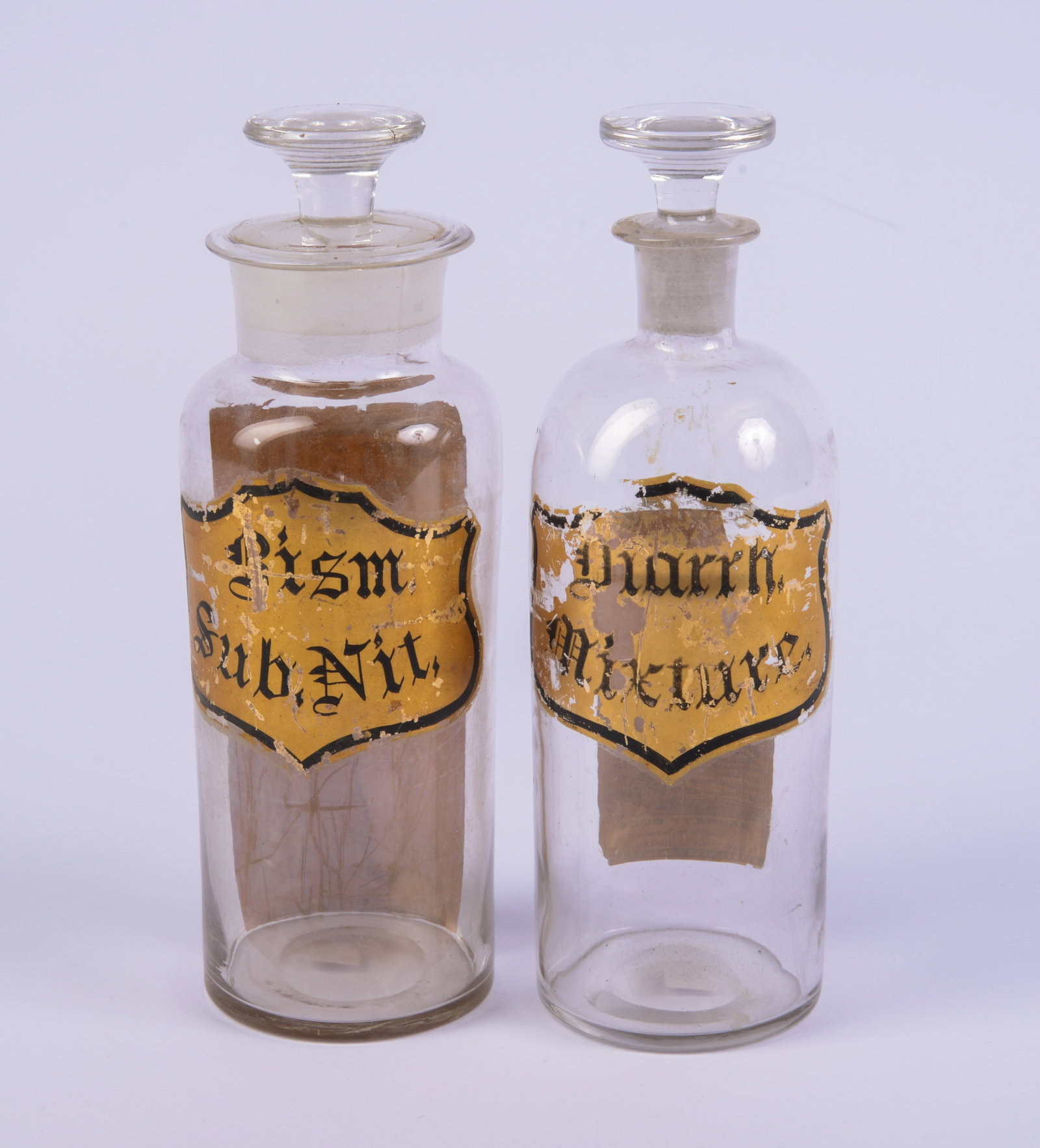 Pair of Apothecary Bottles.: Height 8.5 inches. Good condition, some losses to labels.