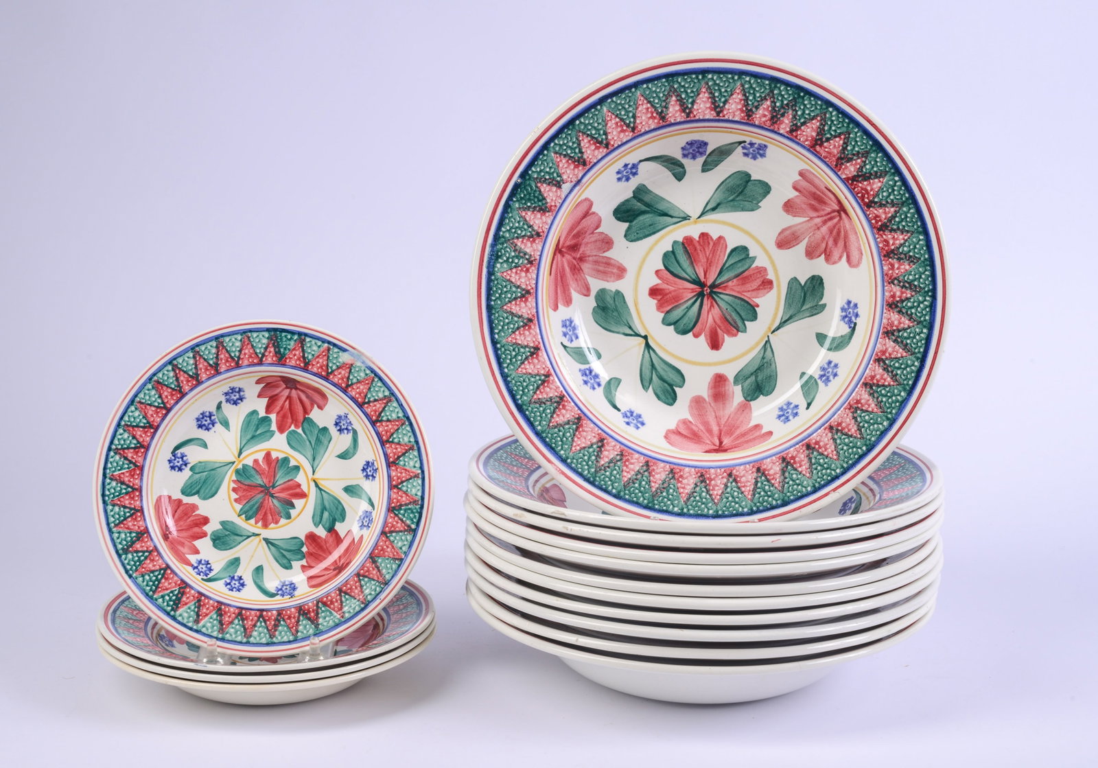 Eleven Nimy Belgian Bowls and Four Plates.: Diameter of bowls 11 inches.