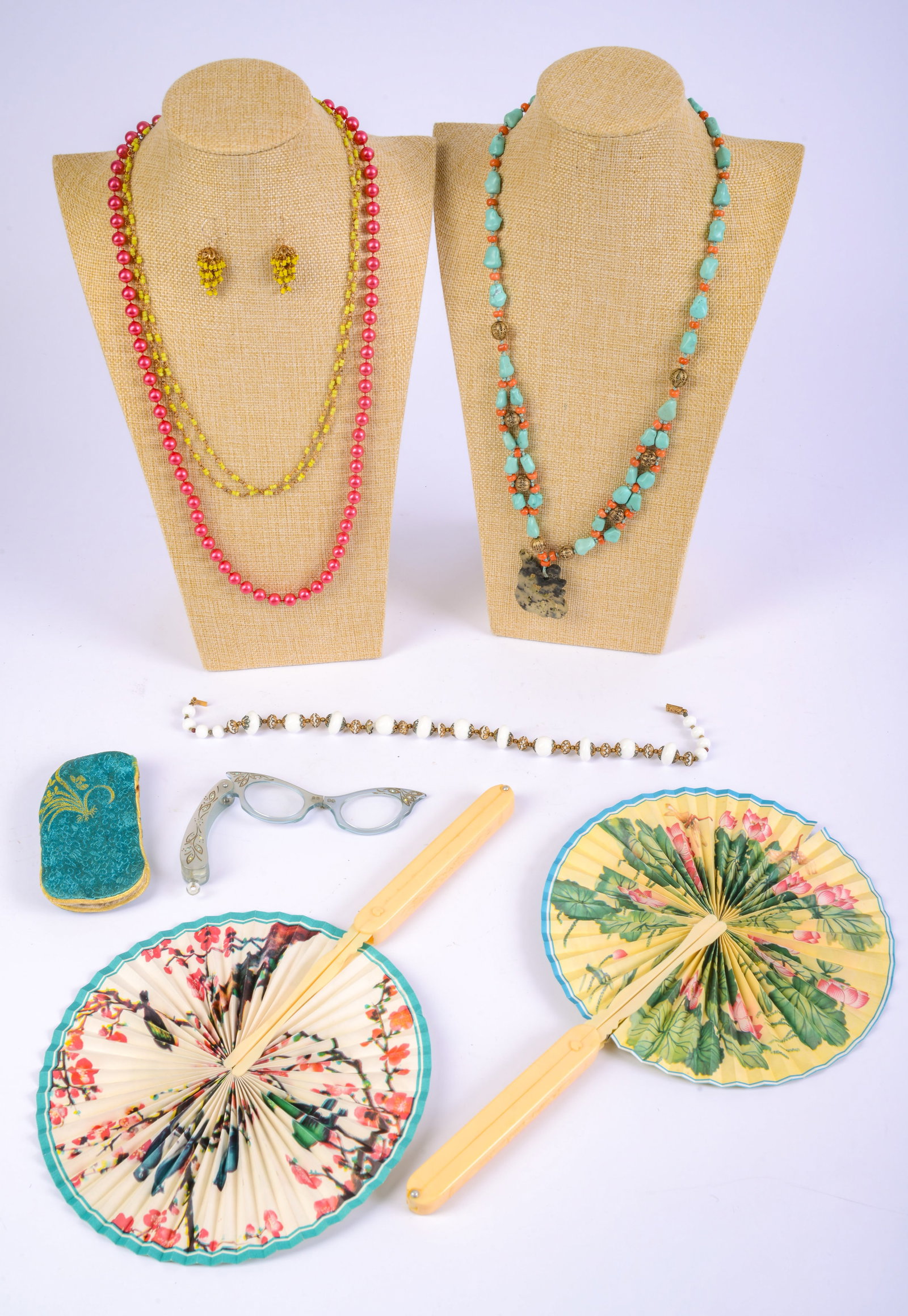 Two Chinese Hand Fans, Opera Glasses, Four Necklaces: One necklace with matching earrings.