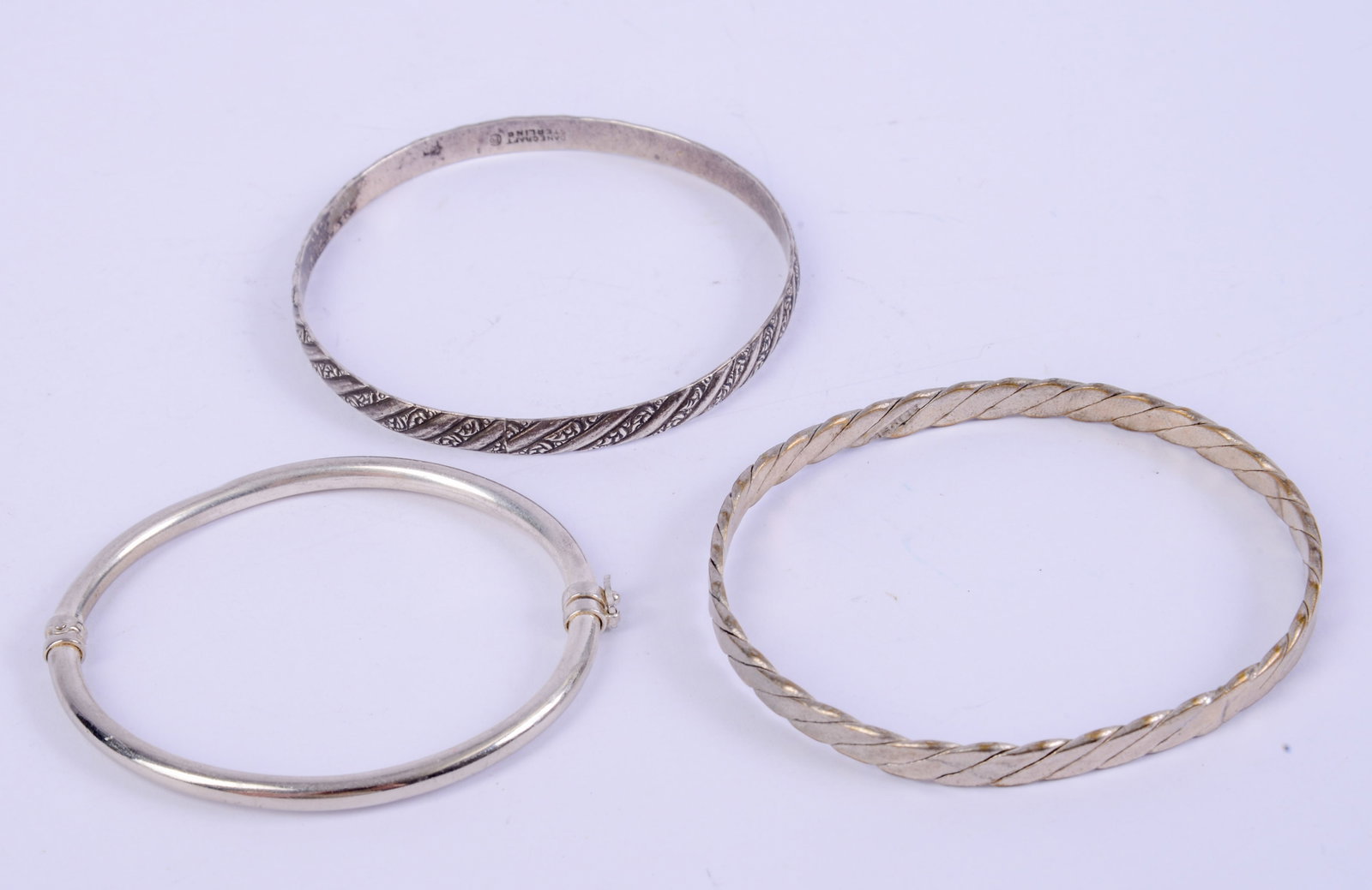 Three Sterling Silver Bracelets.: Diameter 2.5 inches, 36.14 grams.