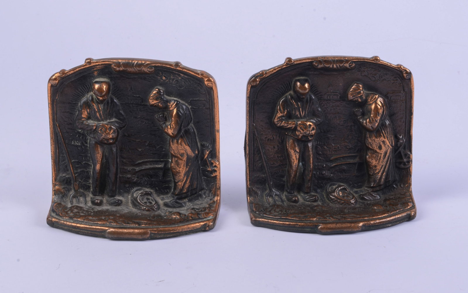 Pair of Bookends With Farmers.: Height 4.5 inches.