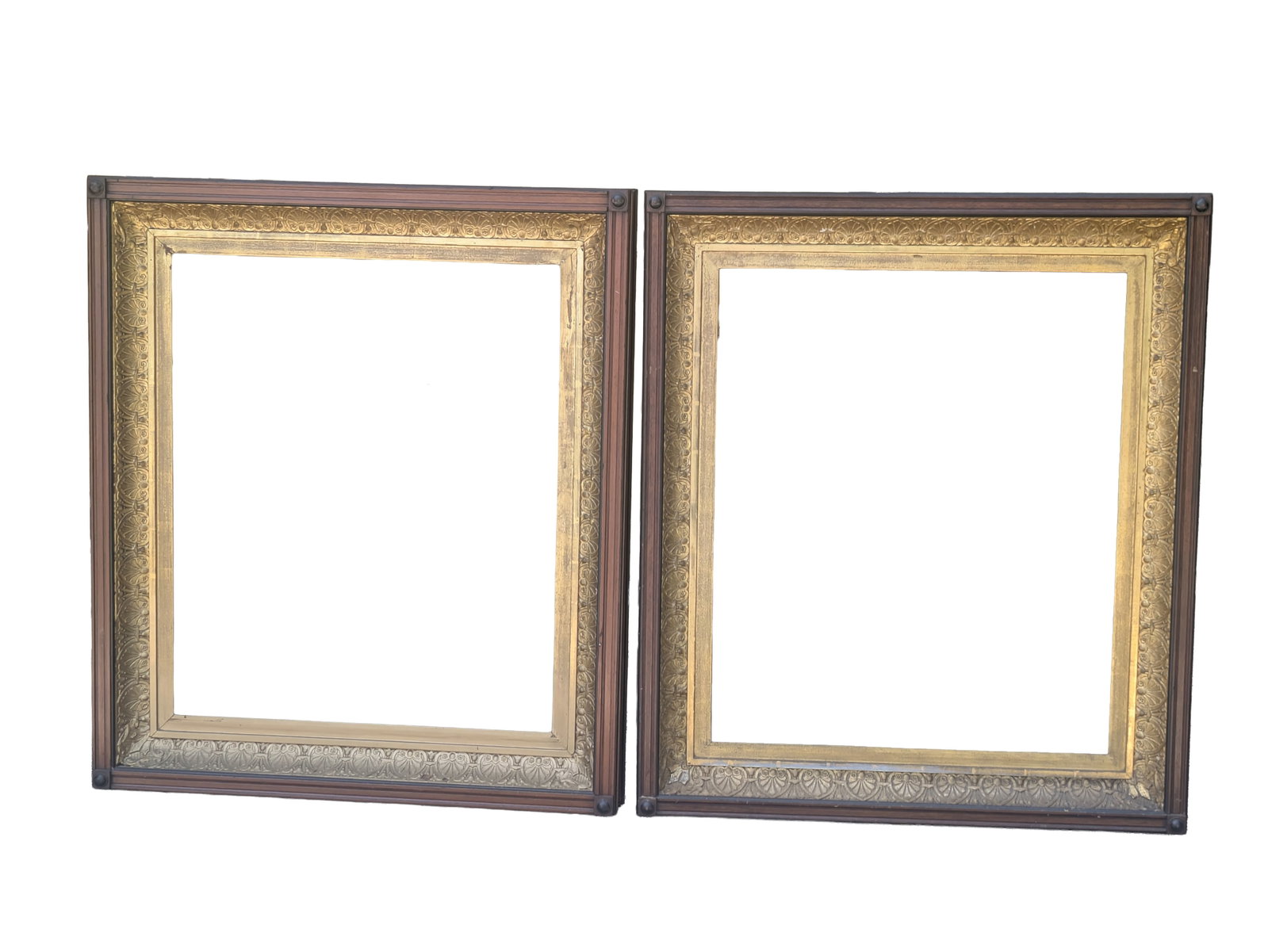 Pair of Walnut and Gilt Frames.: Rabbet 25.25 x 30.5 inches, overall 39 x 33.5 inches.