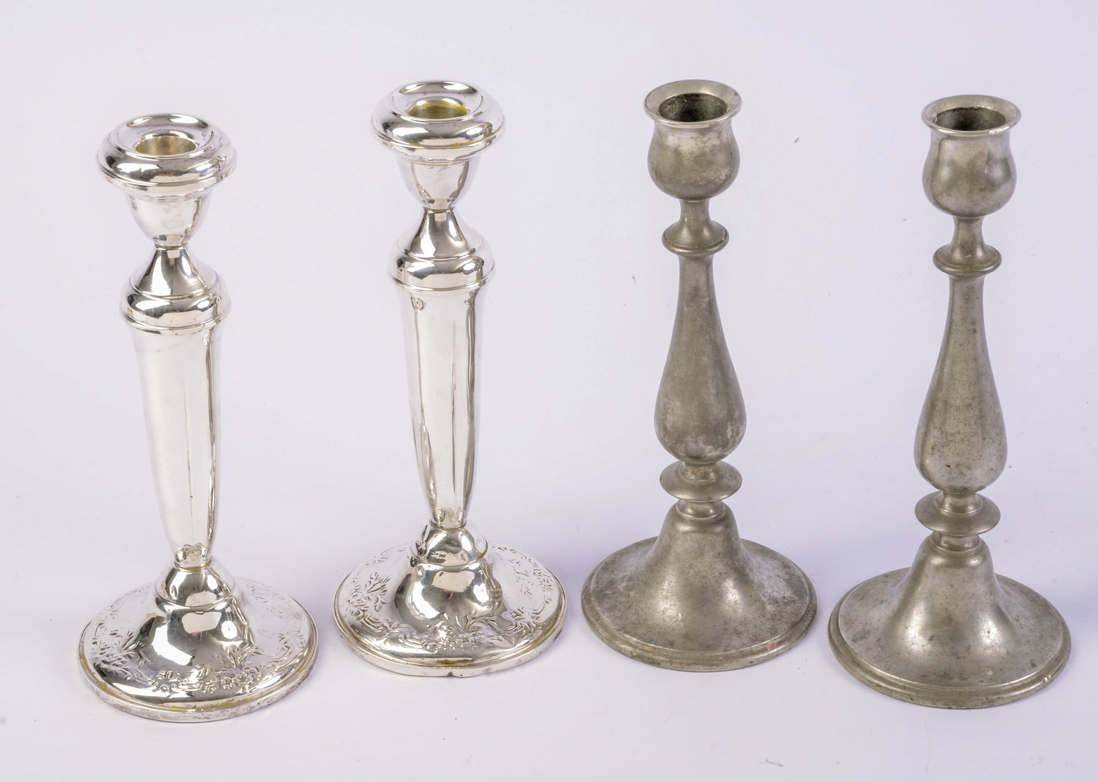 Two Pairs of Candlesticks.: Weighted sterling, height 8.75 inches (dent at base), and a pewter pair.