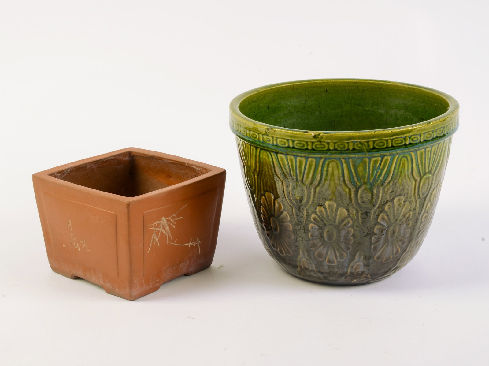 Two Pottery Planters.: Heights 4 and 6.5 inches.