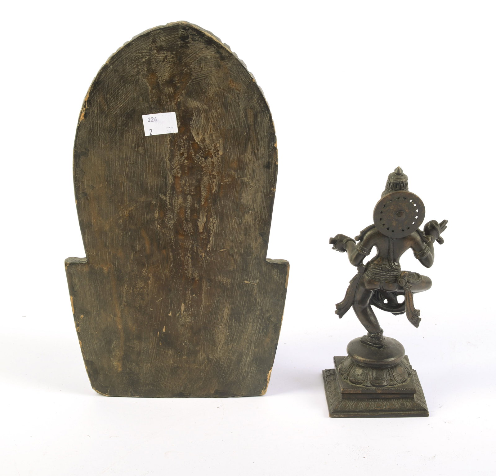 Two Tibetan Religious Statues.: One wood, height 12.5 inches, the other cast metal, height 8 inches.