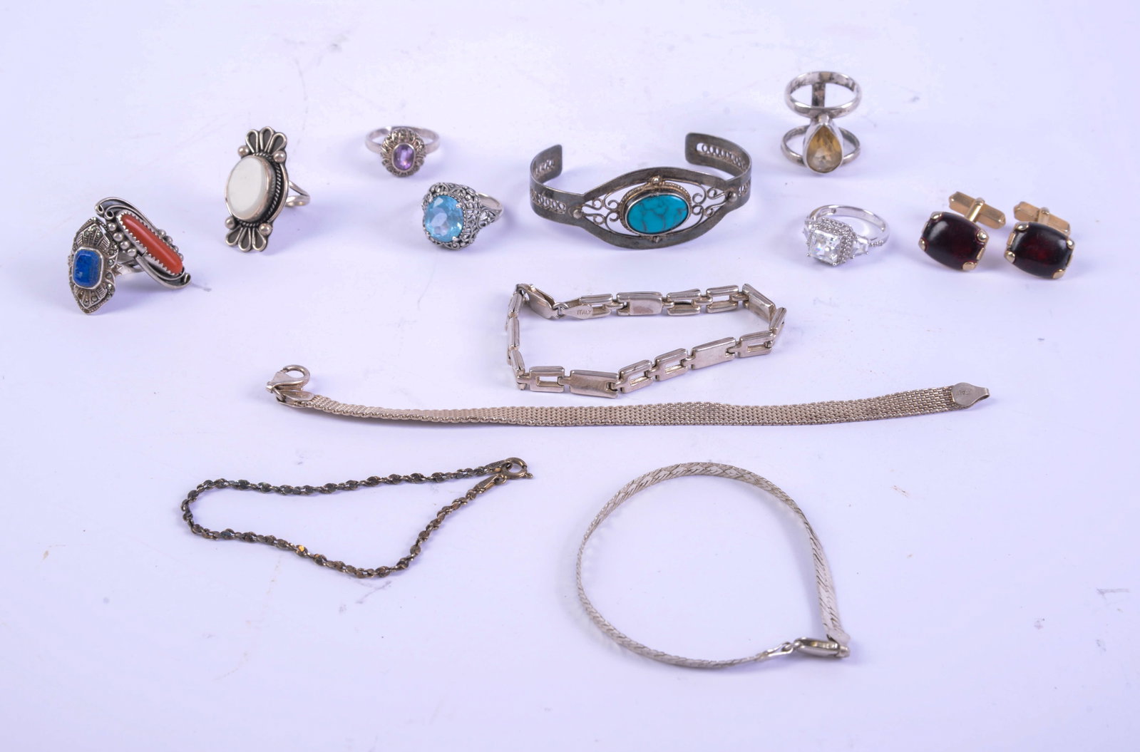 Group of Sterling Jewelry.: Small cuff bracelet with turquoise, 4 bracelets, and 7 rings. Together with a pair of unmarked cufflinks. Total weight 68 grams.