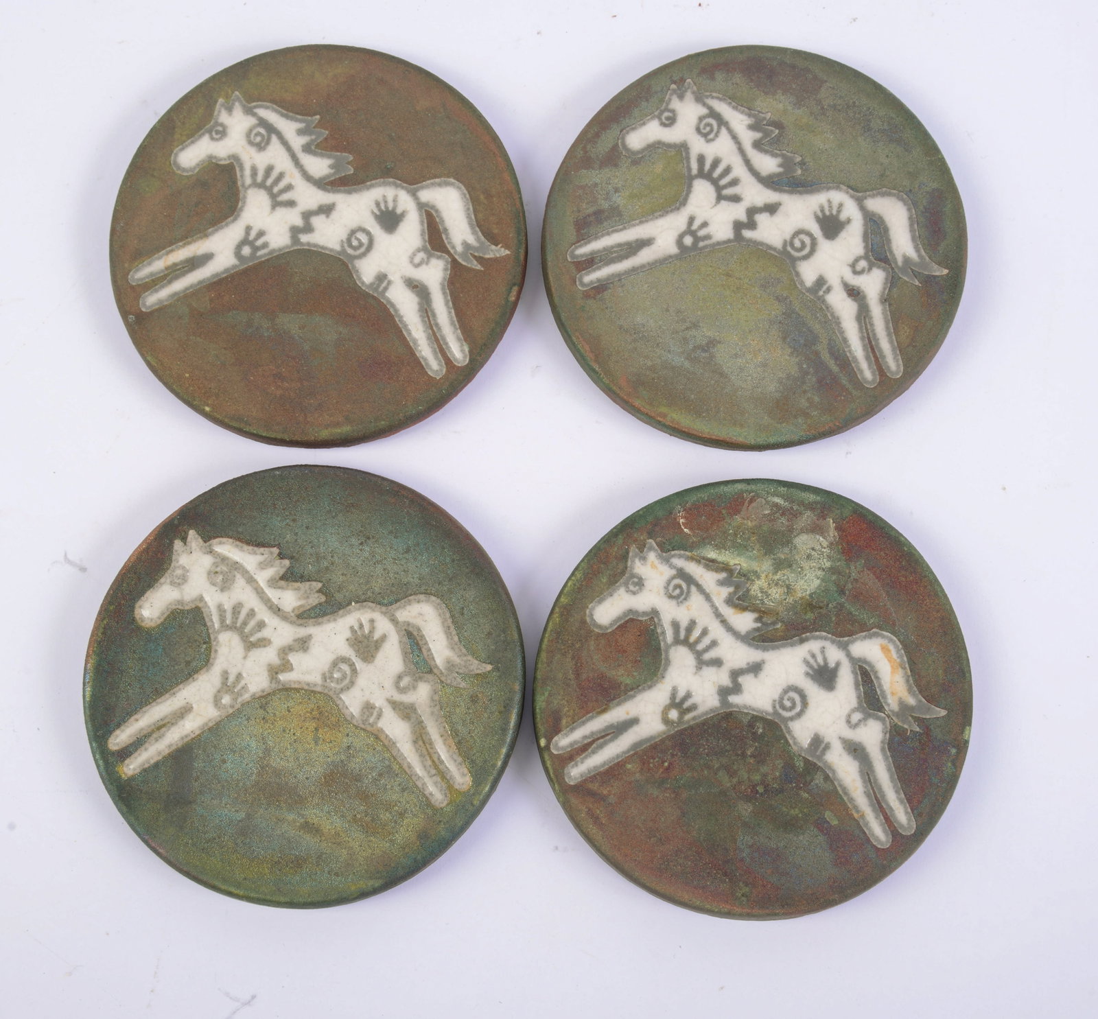 Four Studio Pottery Coasters With Horses.: Diameter 4.25 inches.