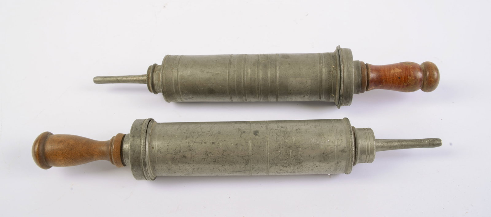 Two Pewter Enema Syringes.: Lenghts 12.5 inches.