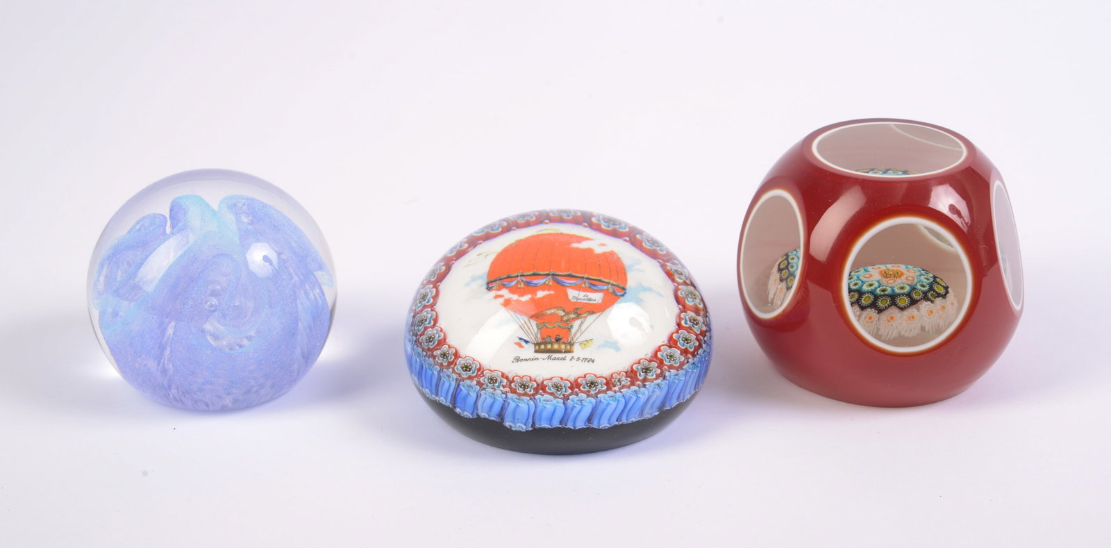 Three Glass Paperweights. - 2