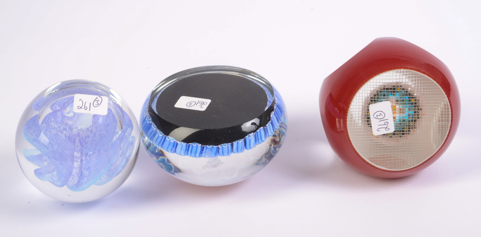 Three Glass Paperweights. - 3