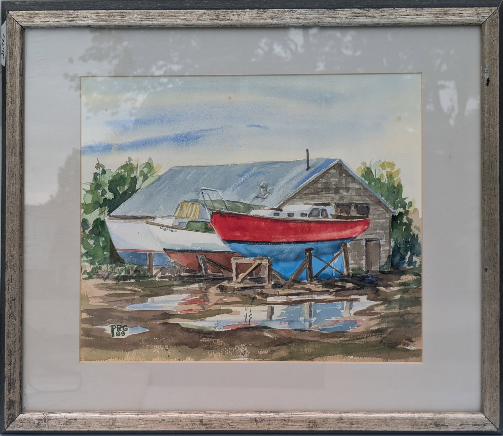 20th Century Painting of Red Sailboat in Dry Dock.: Watercolor on paper, 11 1/2 x 14 1/2 inches, sight. Framed, 18 x 22 inches.