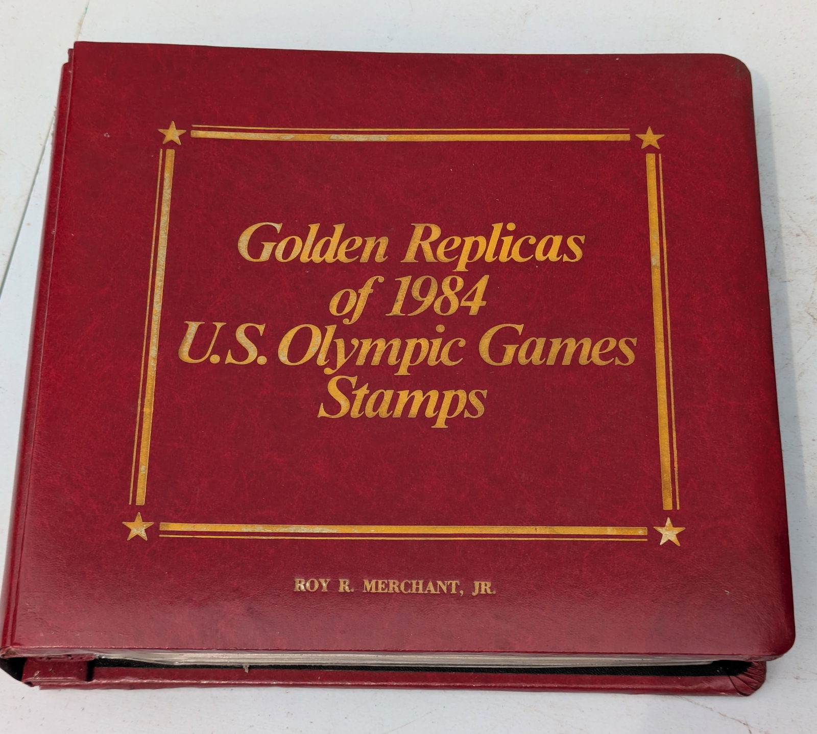 Collection Volume of 12 US Olympic Game Stamps.: First Day of Issue Stamp of 1984 Each having a replica with a 22KT Gold Surface