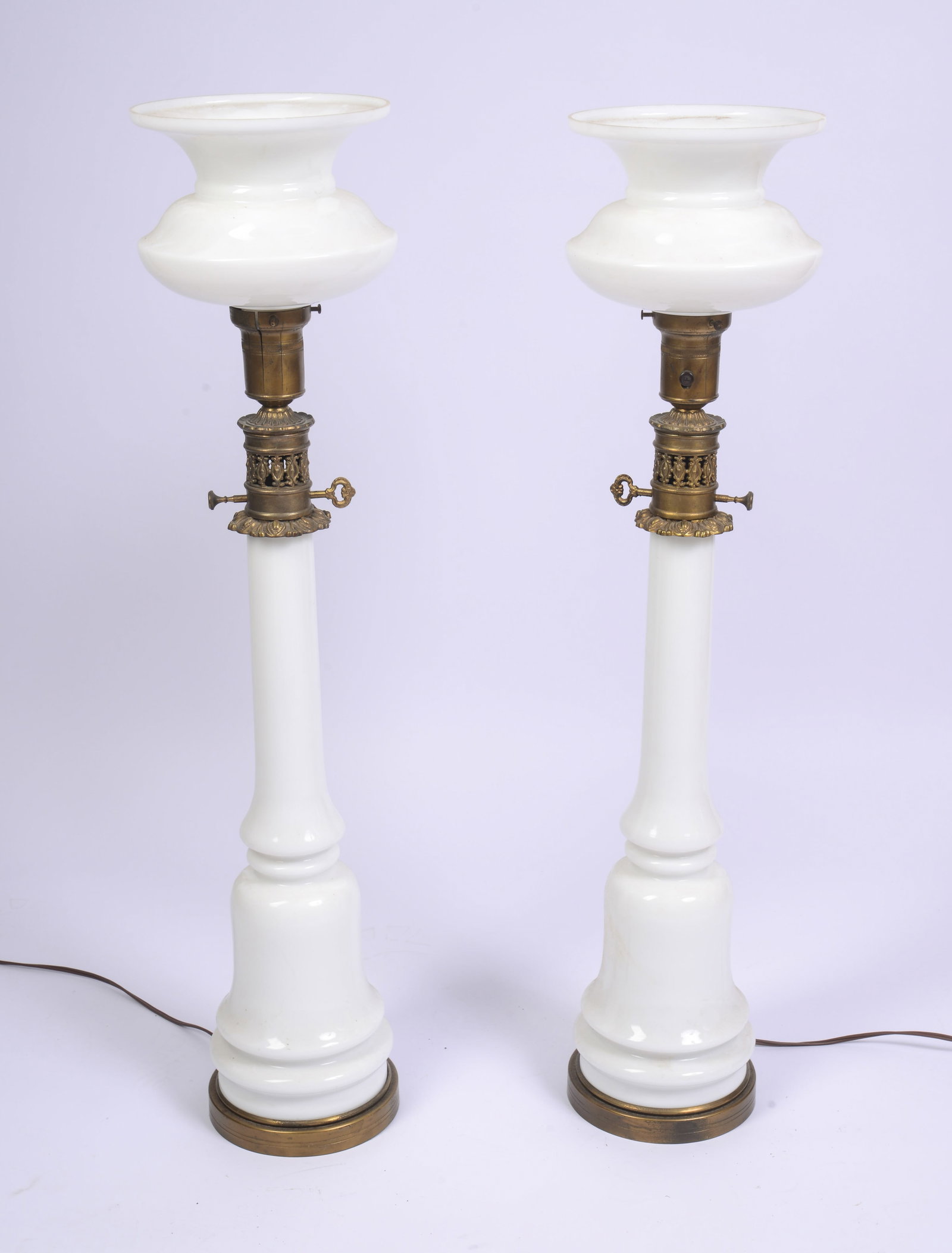 Pair of Large White Glass Lamps.: Height 34 inches. Some chips, lamp holders are cracked.