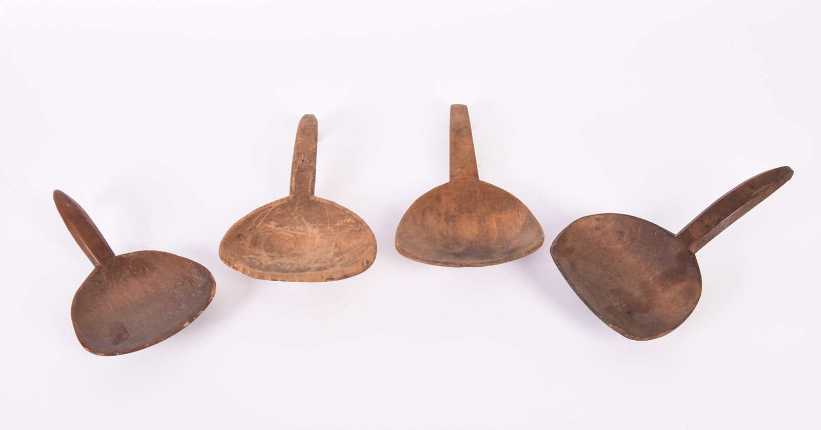 Four Antique Carved Wooden Scoops.: Lengths 9 to 9.5 inches.