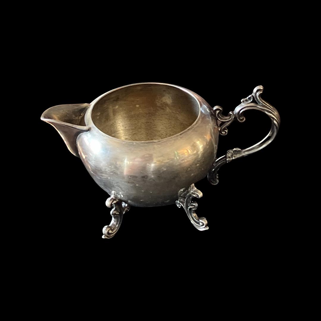 F.B.Rogers Silver Co Trademark 1883 Creamer Spouted Bowl: F.B. Rogers Silver Co. Trademark 1883 Creamer Spouted Bowl, a timeless piece that emanates quality and sophistication, crafted by the renowned F.B. Rogers Silver Company. The beauty of this magnificen