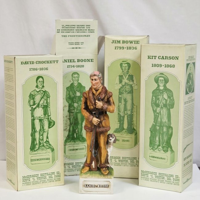 Group of All Frontiersman McCormick Portrait Bottles: Group of 4 Portrait Bottles from The Frontiersman Collection. Includes Daniel Boone, David Crockett, Jim Bowie, & Kit Carson. All include original box and packaging.