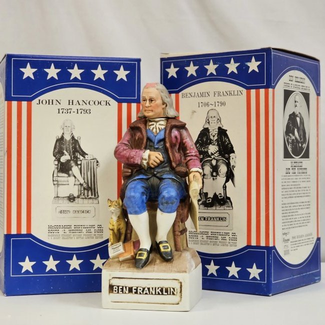 McCormick The Patriots 2 Ben Franklin and John Hancock: 2 Bourbon Whiskey McCormick porcelain bottles, Ben Franklin and one John Hancock, condition as shown, seal is intact some wear on boxes from being stored over time.