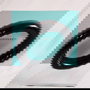 Tiffany & Co., Elsa Peretti Black Lacquer Bracelet: The polished black lacquer of Japanese hardwood, measuring approximately 24.0 mm (0.95 in) in width, inner circumference 7 1/2 inches. Marked "Tiffany & Co., Elsa Peretti, Japan.&qu