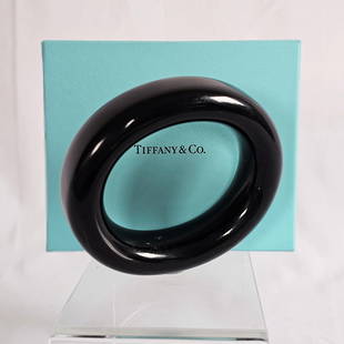 Tiffany & Co., Elsa Peretti Black Lacquer Bracelet: The polished black lacquer of Japanese hardwood, measuring approximately 24.0 mm (0.95 in) in width, inner circumference 7 1/2 inches. Marked "Tiffany & Co., Elsa Peretti, Japan.&qu