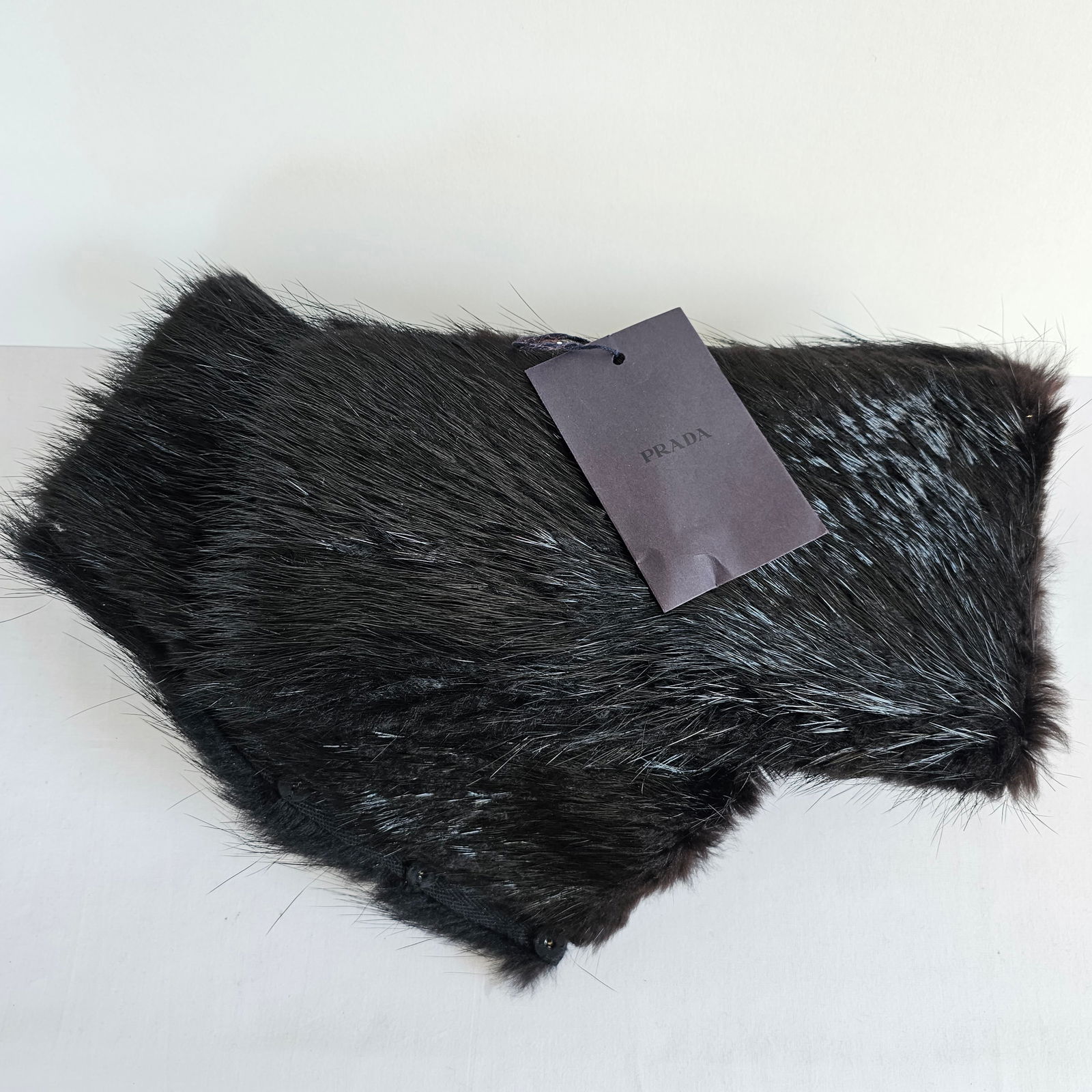 Prada Fur Arm Wraps: Pair of Prada black fur wrist wraps.