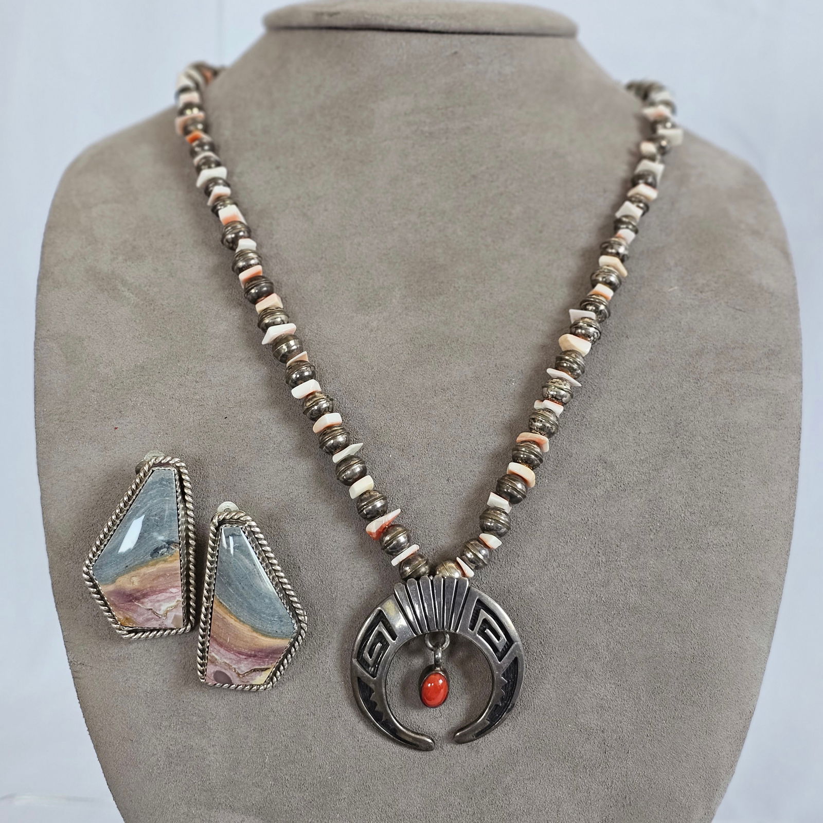 Native American Shell, Jasper, Sterling Silver Necklace and Earrings: Including a necklace comprised of shell beads interspaced by sterling silver bench beads, terminating to a naja suspending an oval coral cabochon, 20 inches, marked "(M?)ike, cast, sterling;"