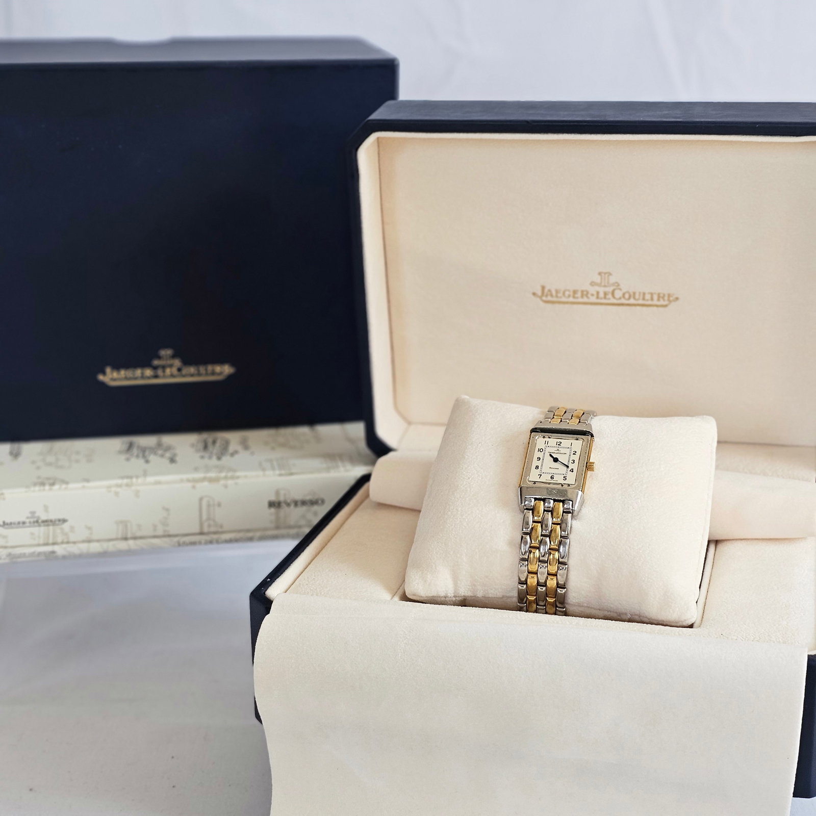Ladies Jaeger LeCoultre Reverso, 18k, Stainless Steel Wristwatch: DIAL: Rectangle, silver tone centering white, black Arabic numeral hour markers, black inner minutes track, blued sword hands, Jaeger LeCoultre, Reverso, Swiss Made. MOVEMENT: Quartz (case not opened)