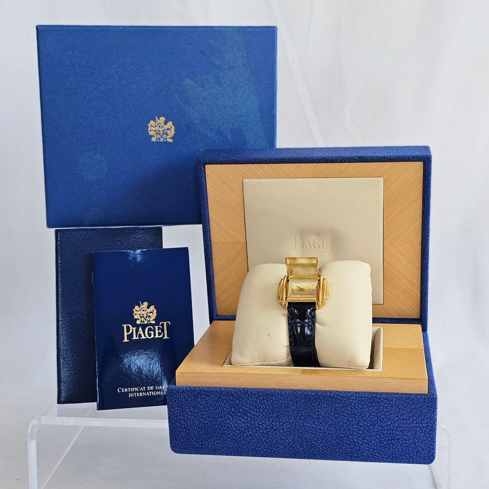 Ladies Piaget 18k Covered Wristwatch: DIAL: Rectangle, brushed white centering yellow gold, applied gold index hour markers, applied "P" at 12 o'clock, gold dauphine hands, Piaget, Swiss. MOVEMENT: Quartz (case not opened).