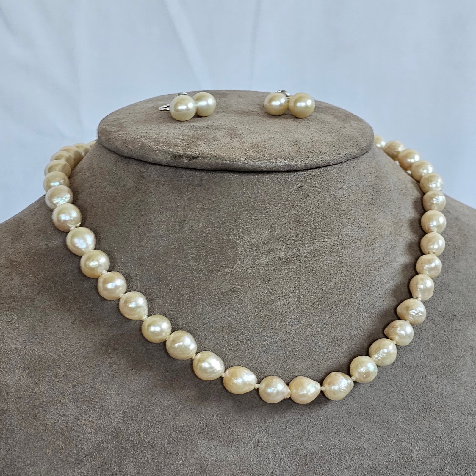 Cultured Pearl, 14k Jewelry Suite: Composed of forty-two baroque cultured pearls, each measuring approximately 7.8 to 7.0 mm, completed by a 14k yellow gold hook and box clasp forming a 14 inch necklace, together with a pair of matchin