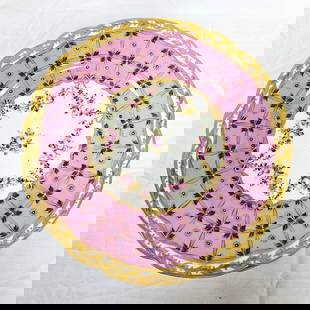Set of 11 Sevres Pink and Gilt Floral Dinner Plates: Set of 11 Sevres porcelain plates with pink floral and gilt accents. Each with the Sevres logo with the "C" in the center for 1755. Plates each measure approximately 9 3/4 in Dia. Condition: there is