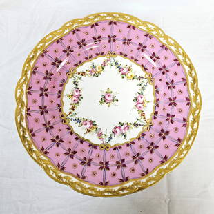 Set of 11 Sevres Pink and Gilt Floral Dinner Plates: Set of 11 Sevres porcelain plates with pink floral and gilt accents. Each with the Sevres logo with the "C" in the center for 1755. Plates each measure approximately 9 3/4 in Dia. Condition: there is