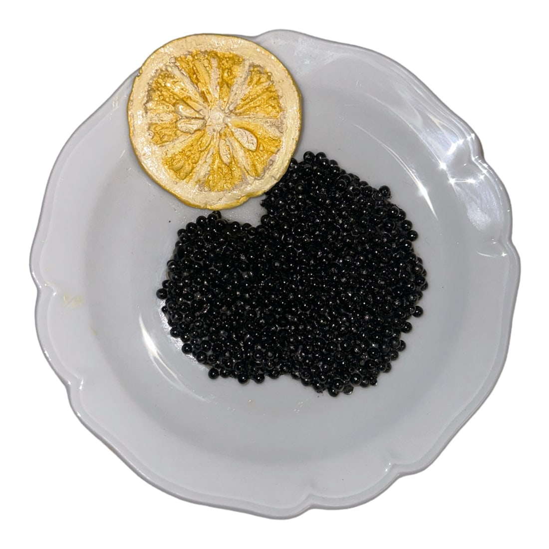 'Caviar' Limoges Plate: Caviar and Lemon Plate signed by Christine Viennet. Appears to have part of original tag from Bergdorf Goodman underneath. Fair/good condition, slight wear if dimensional sculpture.