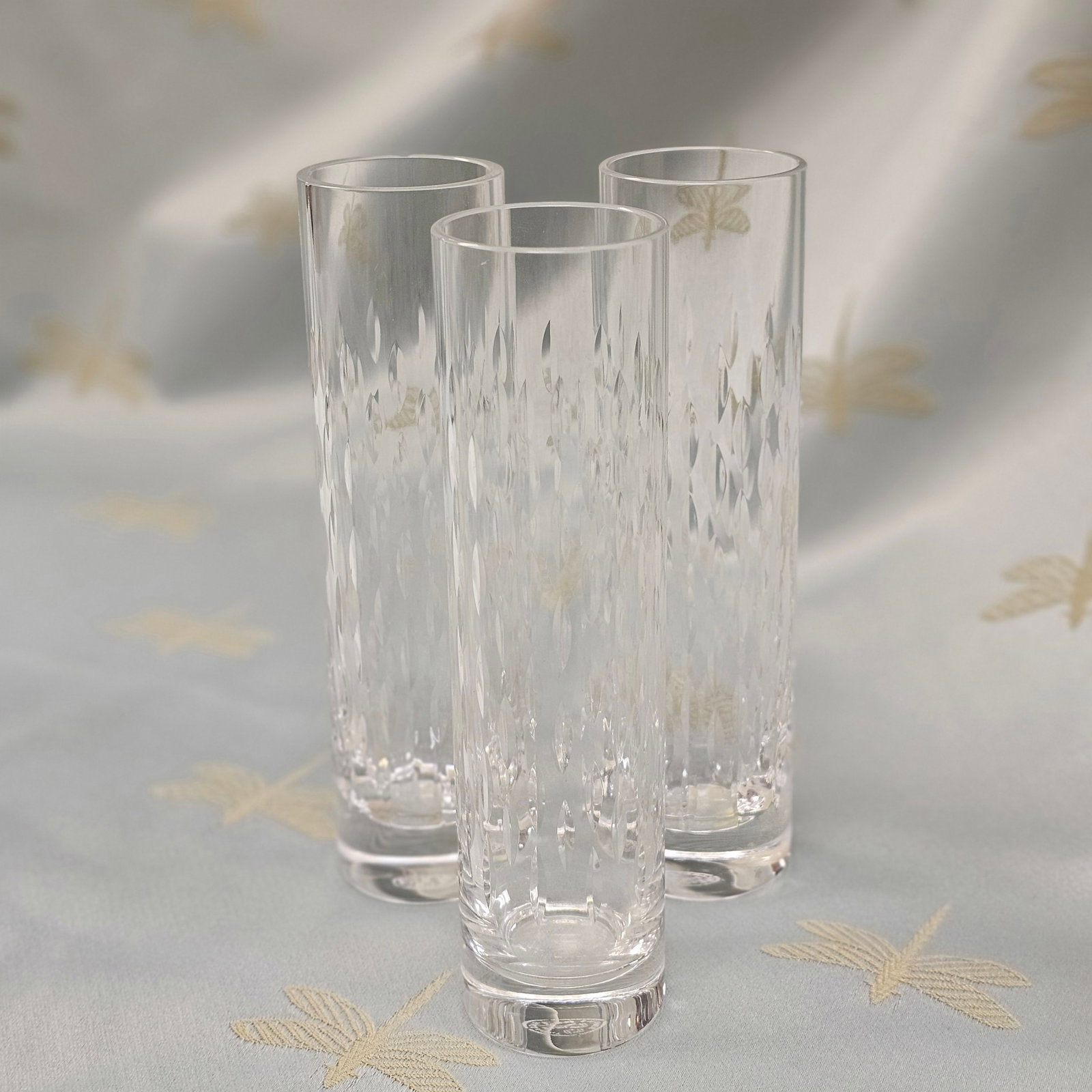 Group of 3 Baccarat "Flora Grain de Riz" Bud Vases: Group of 3 Baccarat "Flora Grain de Riz" (grain of rice) bud vases. Signed on the bottom. One vase also has Baccarat etched on the side. Each vase measures approximately: 7 in T x 1 3/4 in D