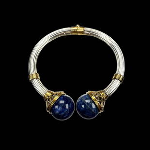 Ilias Lalaounis Sodalite, 18k, Sterling Silver Bracelet: The sterling silver, 18k yellow gold hinged clamper cuff terminating to two round, sodalite finials, inner circumference 6 1/2 inches. Gross weight: 27.8 grams. Marked &quot;Greece, A21 925, maker&#39