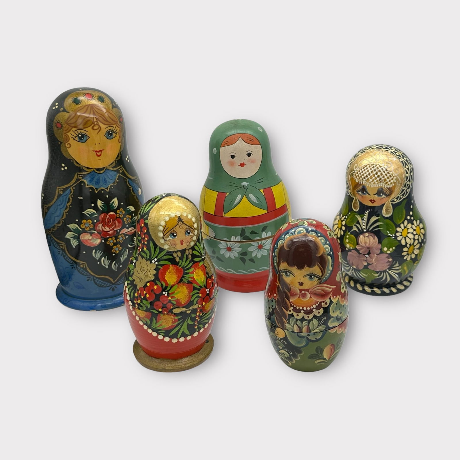 Group of 5 Russian Nesting (Matryoshka) Dolls: Group of 5 Russian Matryoshka lacquer nesting dolls, each signed on bottom. Largest doll of the group measures approximately 8 in T with a circumference of 12 in. Condition is good on all the dolls, n