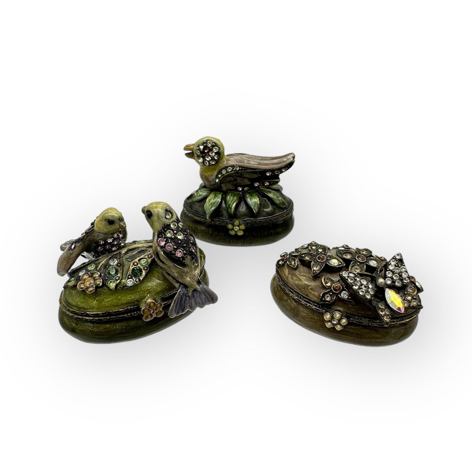 Grouping of Jay Strongwater Bird & Butterfly Pill Boxes: Grouping of three Jay Strongwater petite trinket/pill boxes, hand painted with glittery metallic and with embedded sparkles on the flower and formed accents on lids, some missing as shown. 