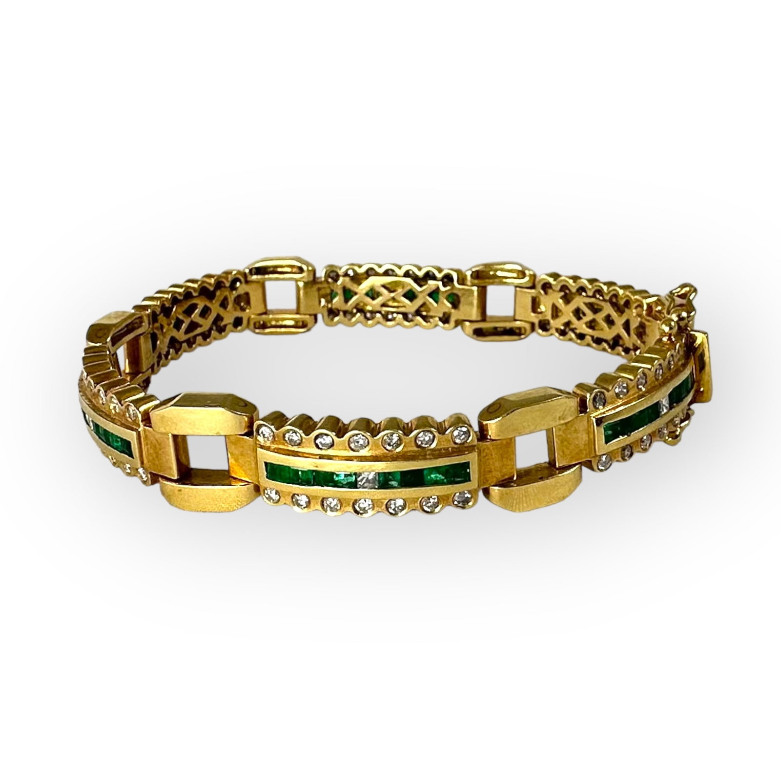 Emerald, Diamond, 18k Yellow Gold Bracelet: Featuring forty-eight square-cut emeralds weighing a total of approximately 0.96 cttw., accented by six square and eight-four round brilliant-cut diamonds weighing a total of approximately 1.98 cttw.,
