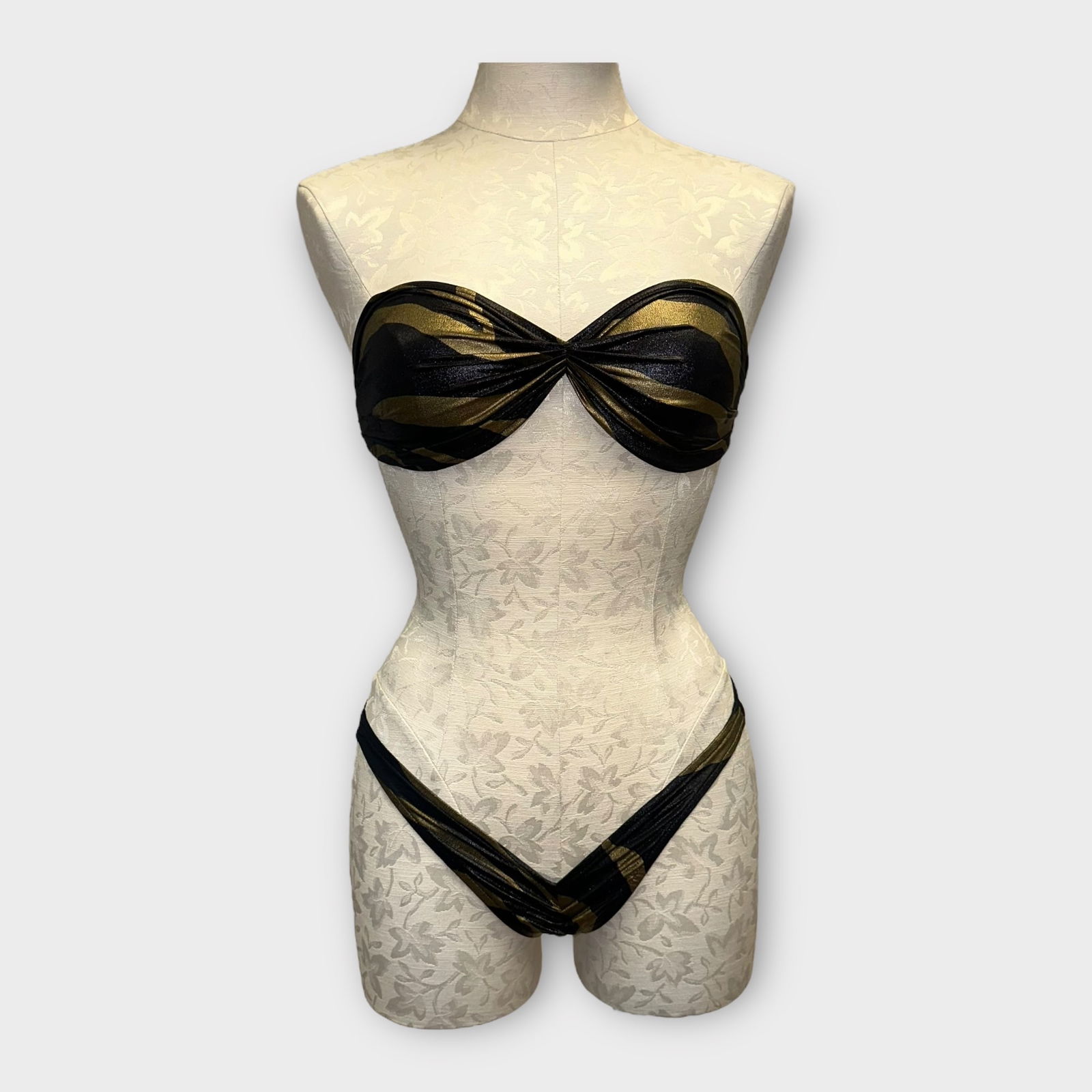 Vintage Two-Piece Bathing Suit, Norma Kamali: Vintage black and gold abstract stripe 2-piece bathing suit by Norma Kamali, strapless top, deep V bottom. Size S Condition is good