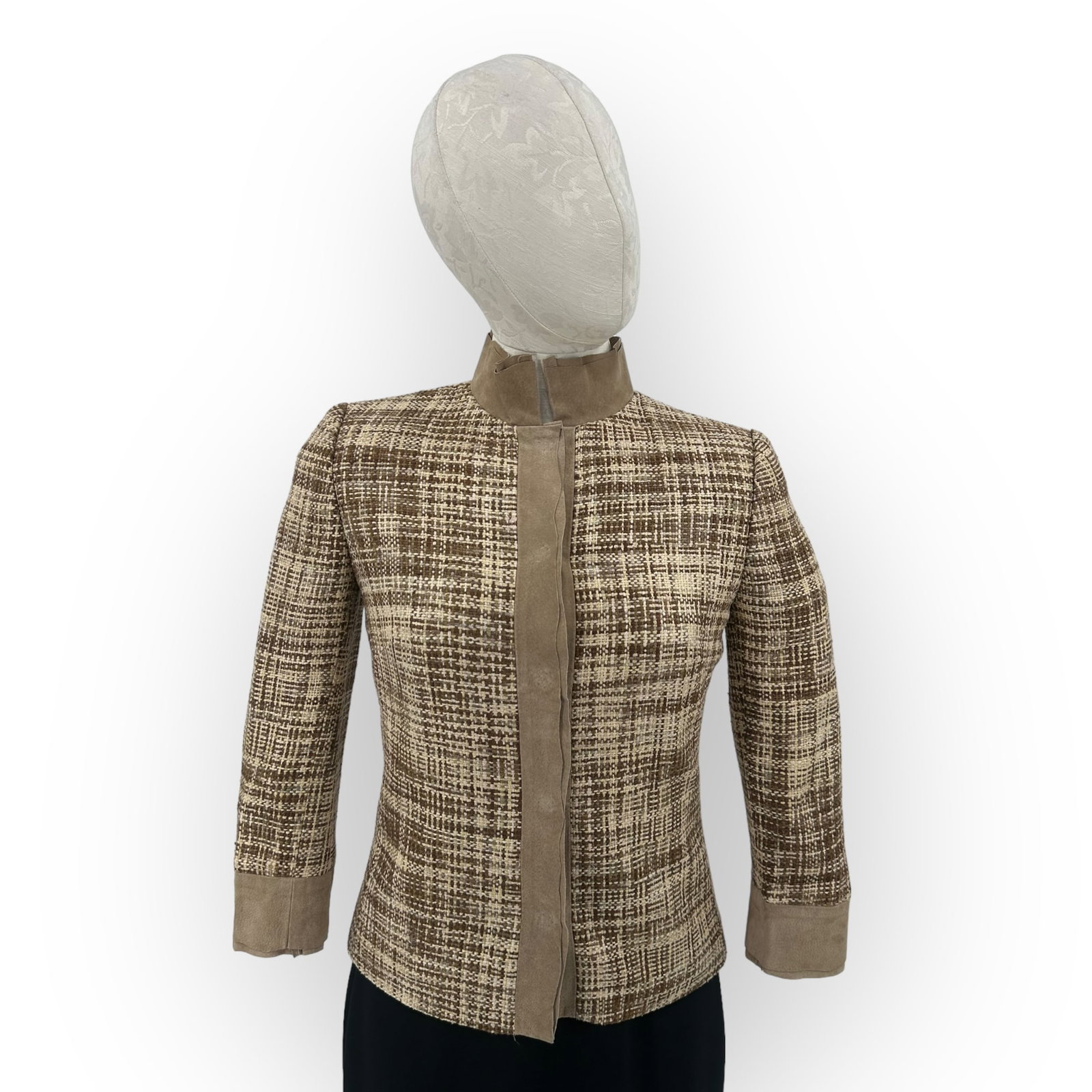 Dolce & Gabbana Tweed and Suede Jacket: Dolce & Gabbana tweed jacket in neutral colors with suede trim, in a 3/4 sleeve length, snap button closure and signature leopard print lining. In size 42. Absence of a condition report does not m