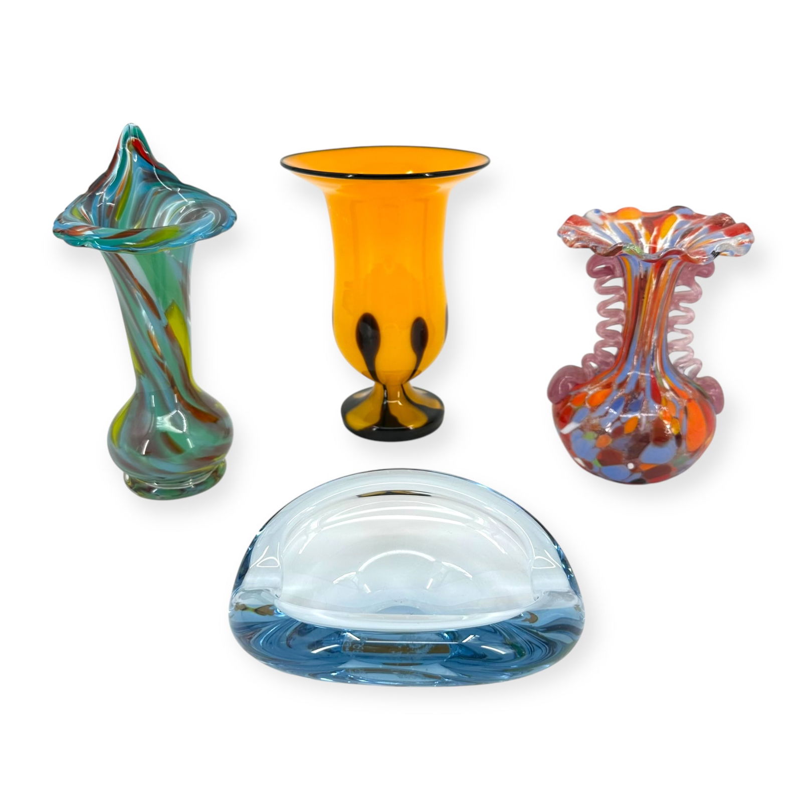 (Lot of 4) Mid-Century Continental Art Glass Group: Consisting of a Danish Holmegaard light blue glass finger bowl designed by Per Lutken, 6"l; a Czechoslovakian yellow and brown art glass vase with fluted rim, 7"h; together with two Italian