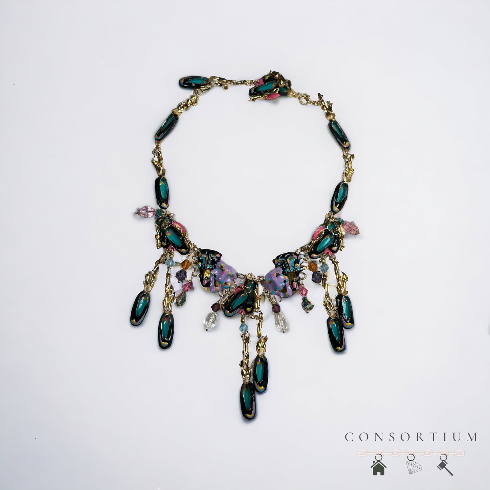 Lunch at the Ritz Enamel, Gold-Tone Theater Themed Necklace: Featuring polychrome enamel masks and slippers accented by crystals, set in a gold-tone mounting completed by a hook and eye clasp forming an 18 inch necklace. Gross weight: 115.2 grams. Etched "