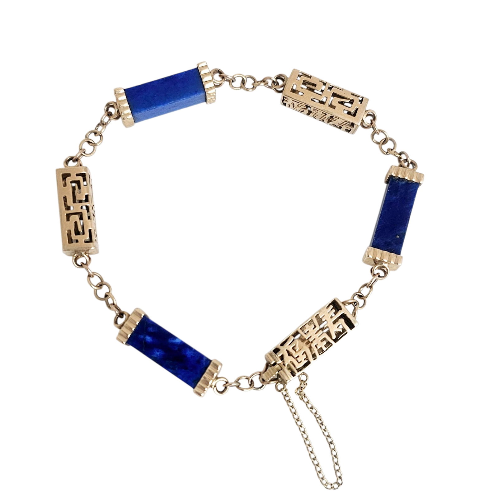 Lapis Lazuli, 14k Yellow Gold Bracelet: Featuring three rectangular lapis lazuli tablets, each measuring approximately 16.0 x 6.3 mm, linked to three 14k yellow gold Asian character stations, completed by a hidden tongue-and-groove cla