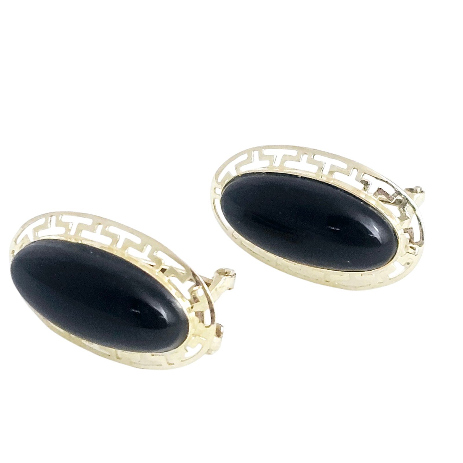 Pair of Onyx, 14k Yellow Gold Earrings: Each centering an oval onyx cabochon set in a Greek key patterned, 14k yellow gold earring mounting measuring approximately 0.85 x 0.50 inches. Gross weight: 4.5 grams. Absence of a condition report d