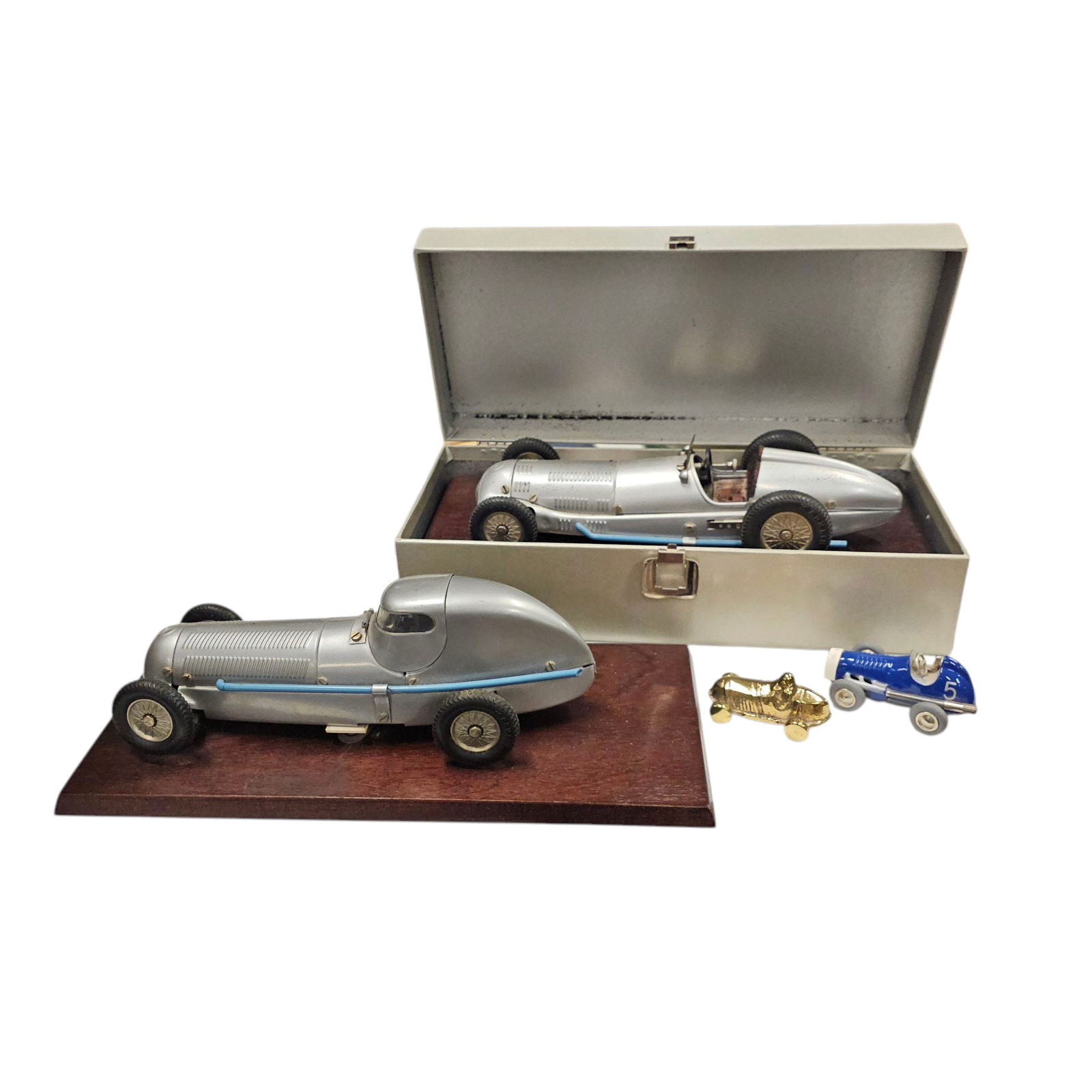 Lot of Racecars includes Marklin & Shuco: Grouping of race cars, the Marklin racecars are two different models, one with a hinged cockpit with figure inset (not removable). Smaller items a cast metal racer, and the Shuco #5 blue model micro r